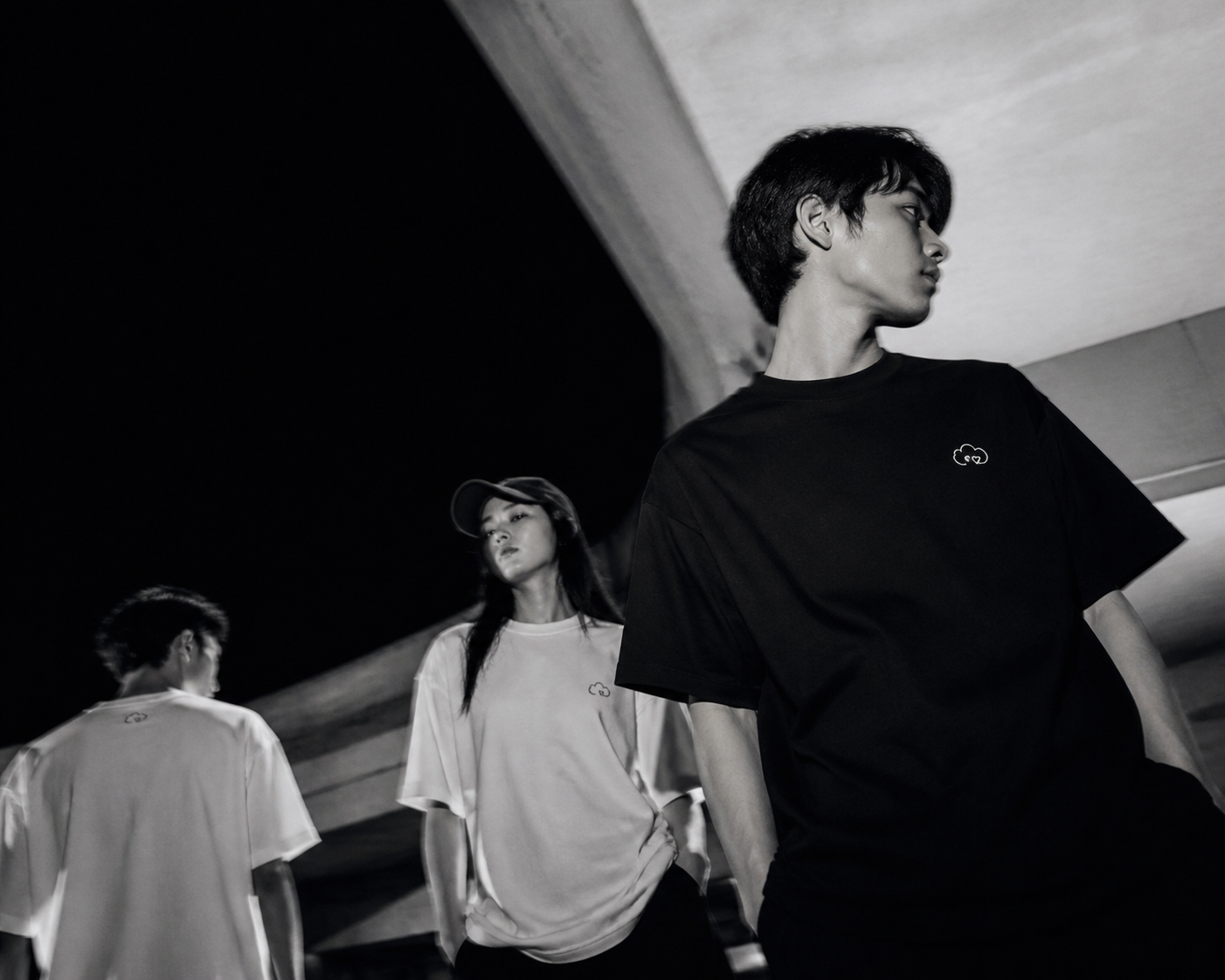 Mune Made streetwear campaign with three models in monochrome oversized tees